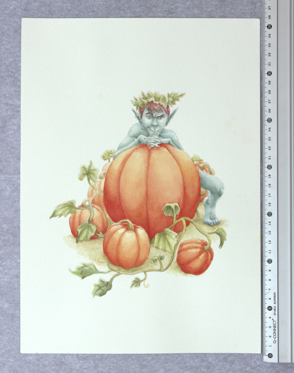 Pumpkin goblin illustration next to a ruler in centimetres.